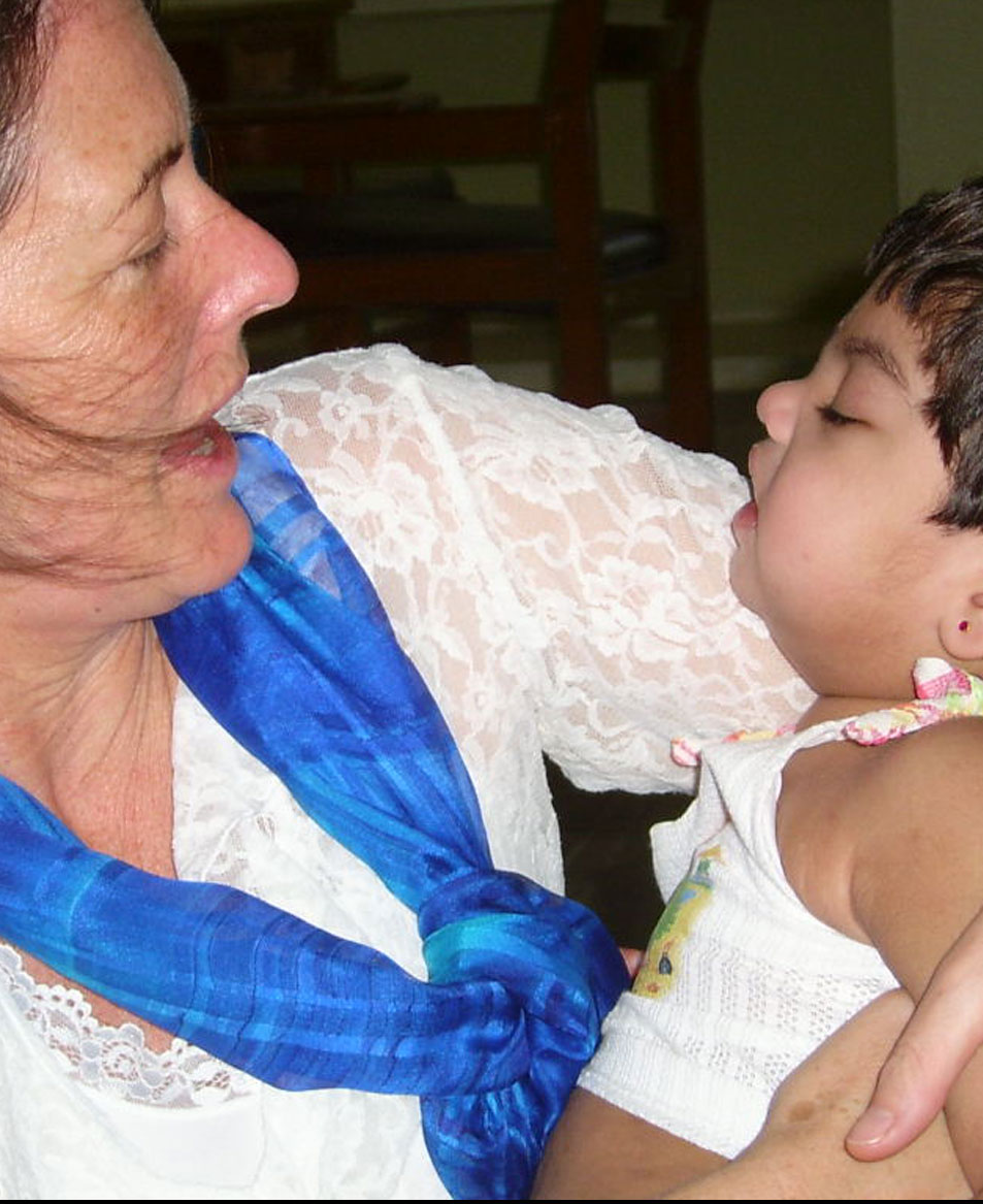 Dr. Linda lawrence, an advisor with Chetana’s Icount project turns her head towards the child in her arms.