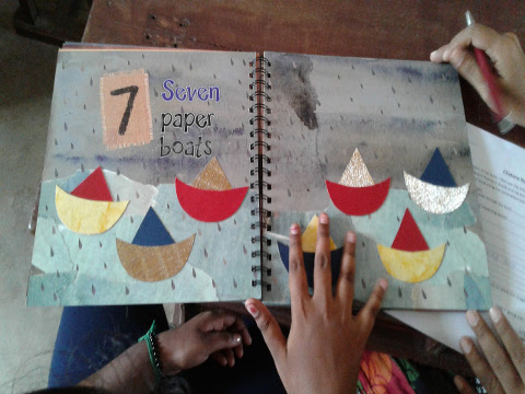 A young girl explores ‘7 Paper Boats’ - an accessible tactile story book.